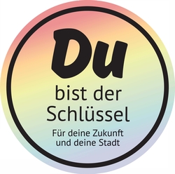 Kreis in bunten Farben mit der Aufschrift: Du bist der Schlüssel. Für deine Zukunft und deine Stadt